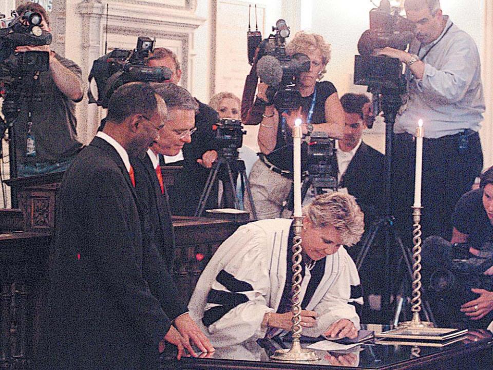 A historic moment at the Arlington Street Church, David Wilson and Rob Compton, the first of the seven Goodridge couples to legally tie the knot. Photo by Marilyn Humphries.